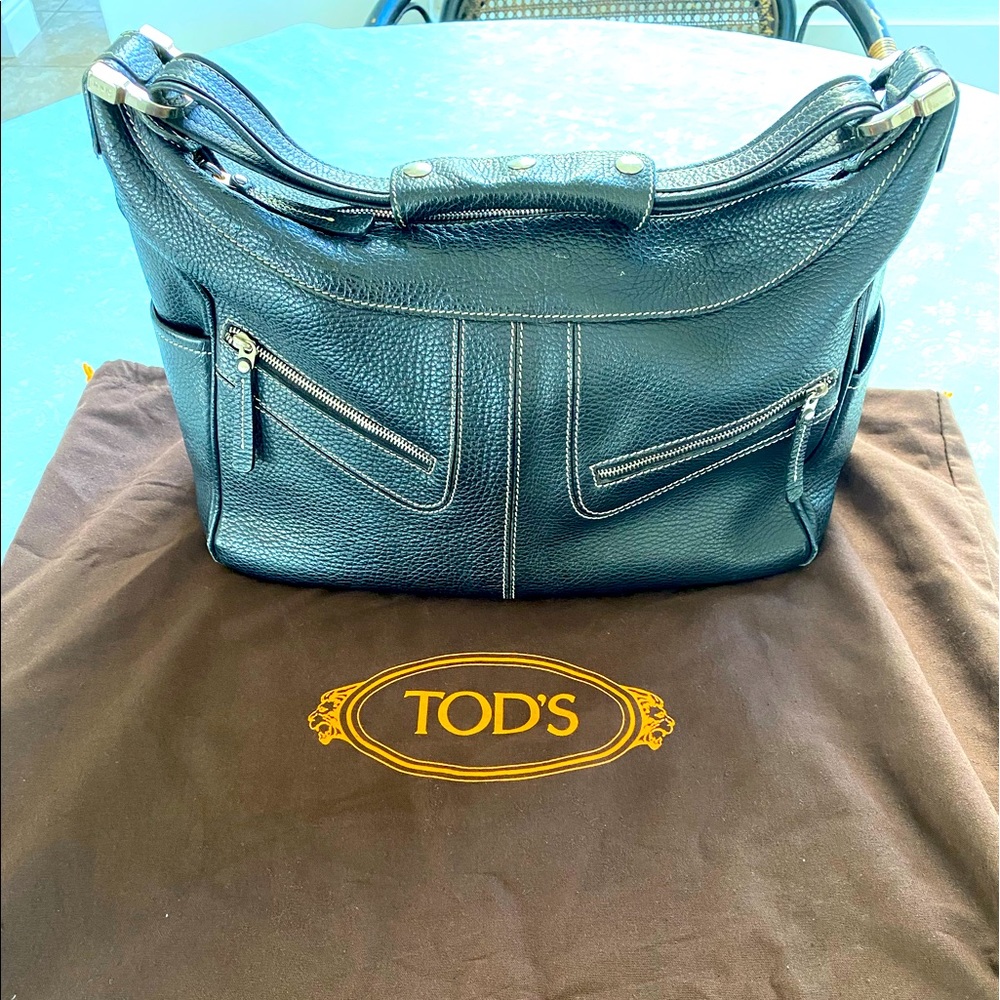 TOD’S black Leather Handle bag. White Stitching. Top Zip. Inside zipper.